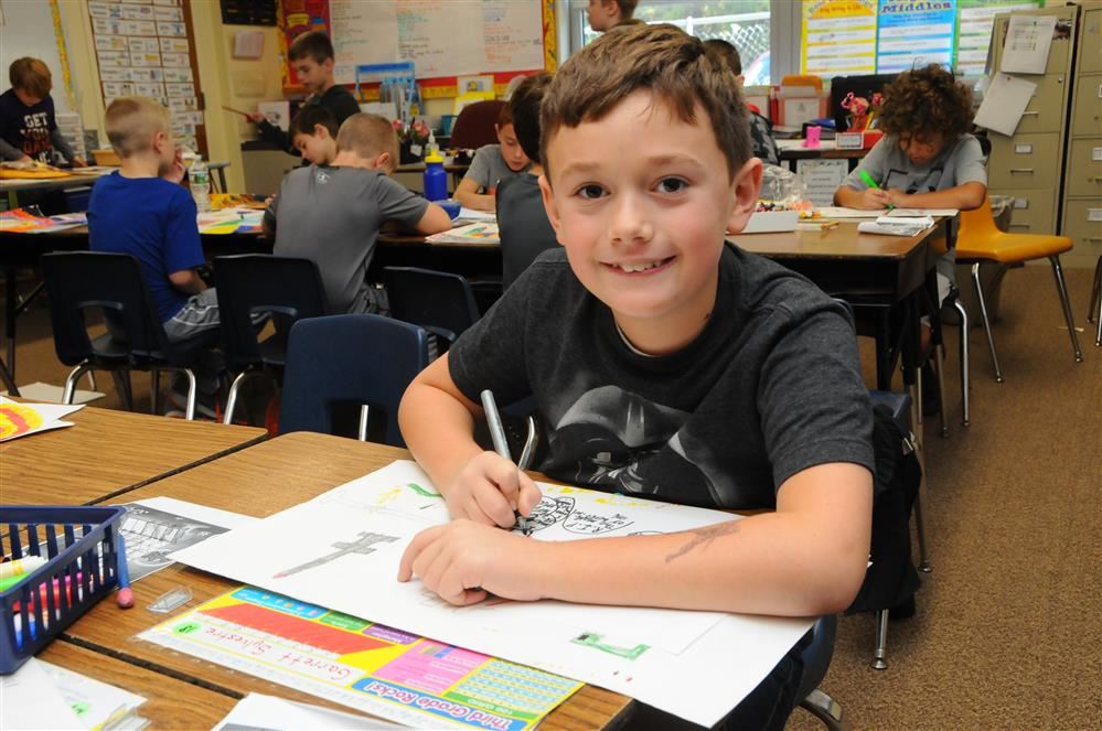 boy smiling in class boy smiling in class